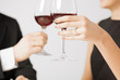 engaged couple with wine glasses