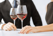 engaged couple with wine glasses