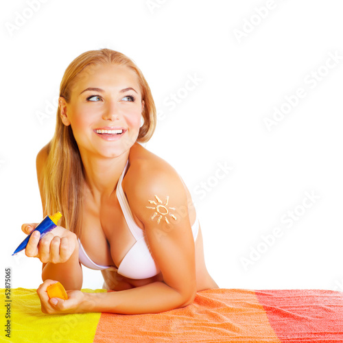 Photo: Pretty woman applying suncream Pretty woman applying suncream