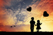 Children with balloons in the shape of heart