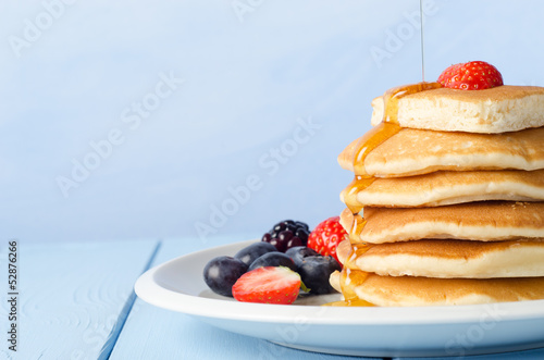 Photo: Stacked Pancakes and Fruit with Maple Syrup Stacked Pancakes and Fruit with Maple Syrup