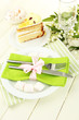 Table setting in white and green tones