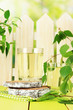 Glasses of birch sap on green wooden table