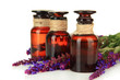 Medicine bottles and salvia flowers, isolated on white