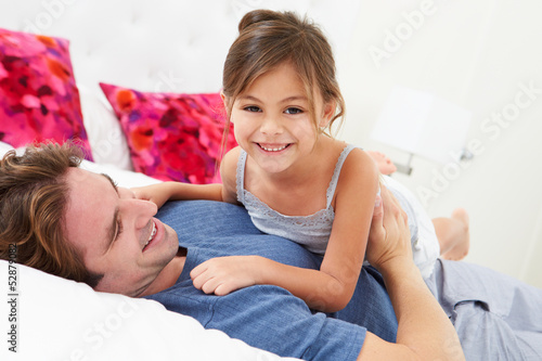 Photo: Father And Daughter Lying In Bed Together Father And Daughter Lying In Bed Together