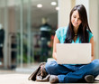Casual woman working online