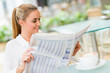 Photo: Business woman reading news Business woman reading news