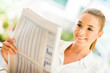Woman reading the newspaper