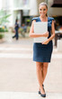 Business woman holding laptop