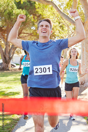 Photo: Male Runner Winning Marathon Male Runner Winning Marathon