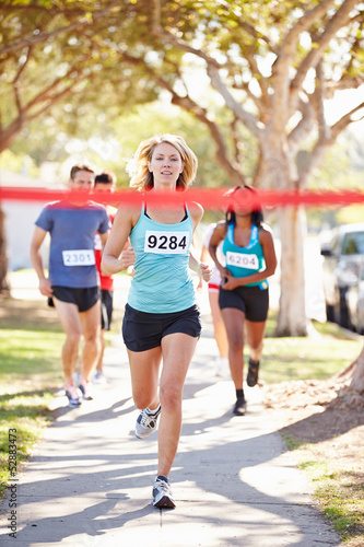 Photo: Female Runner Winning Marathon Female Runner Winning Marathon