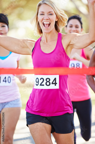 Photo: Female Runner Winning Marathon Female Runner Winning Marathon