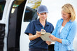 Customer Signing For Delivery From Female Courier
