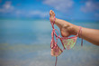 bra on the female's foot on exotic beach