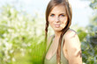 beautiful brunette woman in the park on a warm spring day
