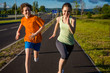 Girl and boy running, jumping outdoor