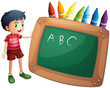 A boy holding the blackboard with crayons at the back