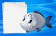 A piranha beside an empty signage under the sea