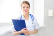 female doctor holding a notepad