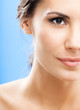 Portrait of beautiful woman, on blue