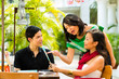 Asian man and woman in restaurant