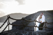Newlyweds on the volcanic landscape background.