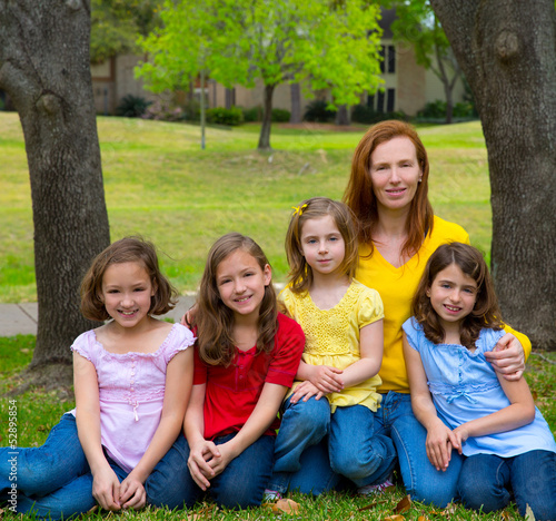 Photo: Mother teacher with daughter pupils in playground park Mother teacher with daughter pupils in playground park