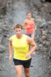 Runner man running on trail in cross-country
