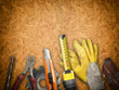 Set of tools over a wood panel