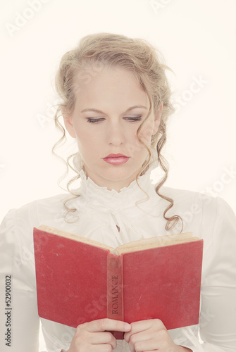 Photo: woman reading romantic book woman reading romantic book