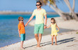 Father and kids on a beach