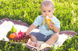 Beautiful little baby boy eats banana