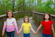 Photo: sister friends walking holding hands on lake wood sister friends walking holding hands on lake wood