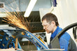 repairman grinding metal body car