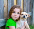 Photo: Blond happy girl with her chihuahua doggy portrait Blond happy girl with her chihuahua doggy portrait
