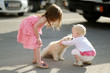 Two girls met a puppy