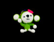 handmade crochet monkey doll on black background