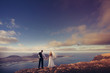 Newlyweds staring at the horizon in Canary Islands.