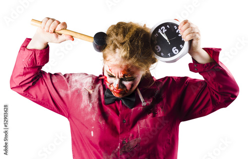 Photo: Late zombie with clock and hammer. Halloween time Late zombie with clock and hammer. Halloween time