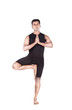 Yoga tree pose on white