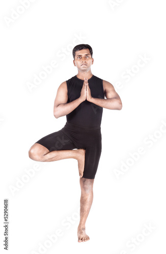 Photo: Yoga tree pose on white Yoga tree pose on white