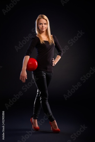 Photo: Pretty dancer holding ball Pretty dancer holding ball