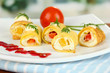 Foto: Egg rolls with cheese cream and paprika,on plate, Egg rolls with cheese cream and paprika,on plate,