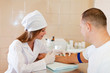 Nurse giving male patient an injection