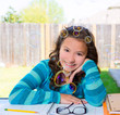 American latin teen girl doing homework on backyard