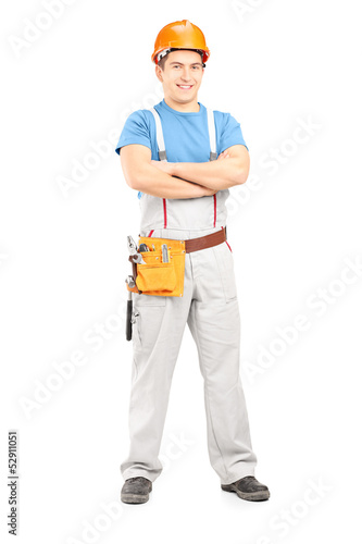 Photo: Full length portrait of a confident repairman in a uniform Full length portrait of a confident repairman in a uniform