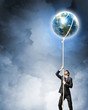 Image of businessman climbing rope