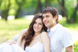 Photo: Young love Couple smiling under blue sky Young love Couple smiling under blue sky