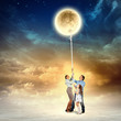 Family pulling moon
