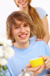 Foto: Young happy man drinking tea Young happy man drinking tea
